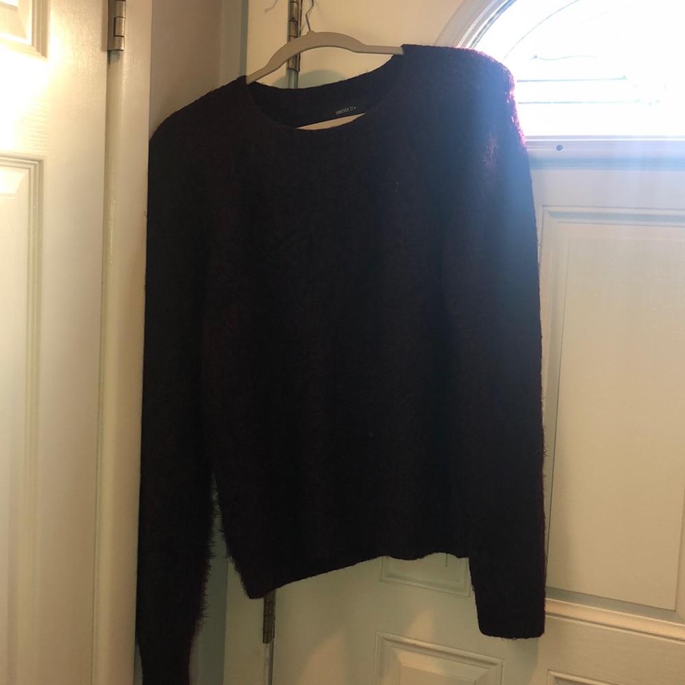 Burgundy sweater.
